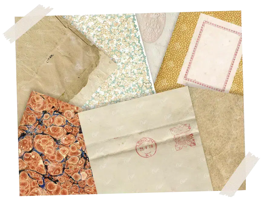 An assortment of aged papers, envelopes, and decorative patterns laid out on a desk